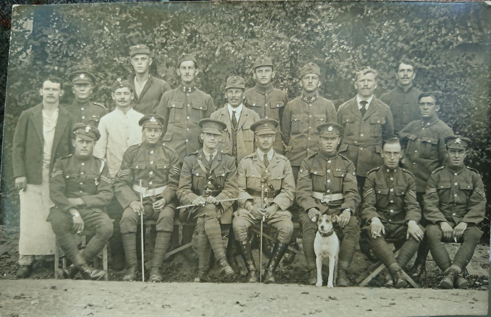 A Graves registration team... Those who locate., identify and exhumed Battlefield Graves in 1919/21. Capt SG Outwin, leader of this group seated centre right in lighter coloured uniform 