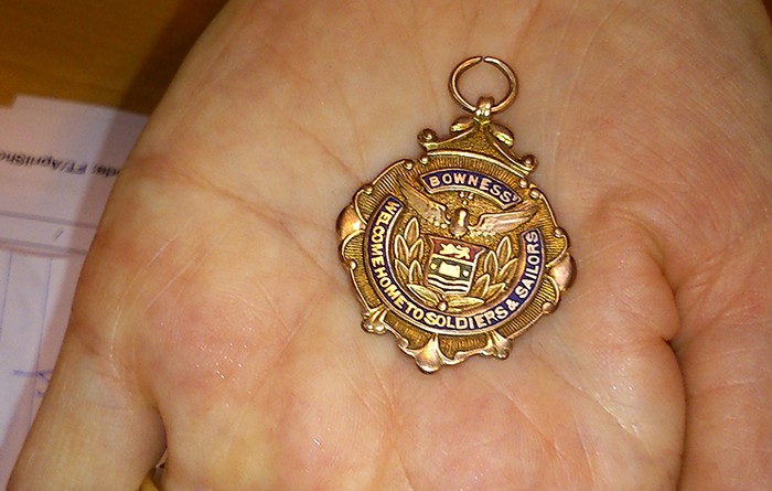 A close-up of Sarah Lee's WW1 solid gold servicemen's thank you present from the Bowness community.