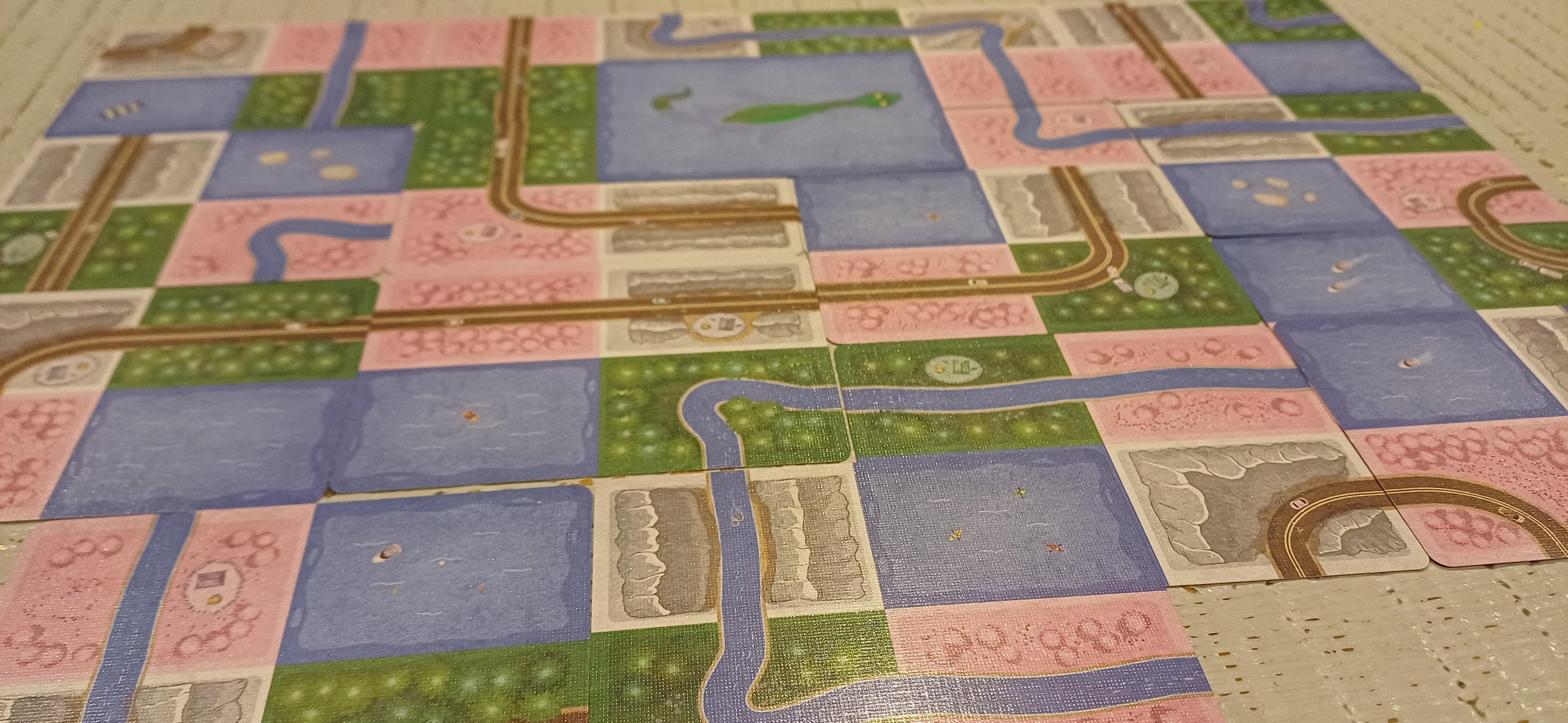 Cards laid out to make a city, in the card game Sprawlopolis